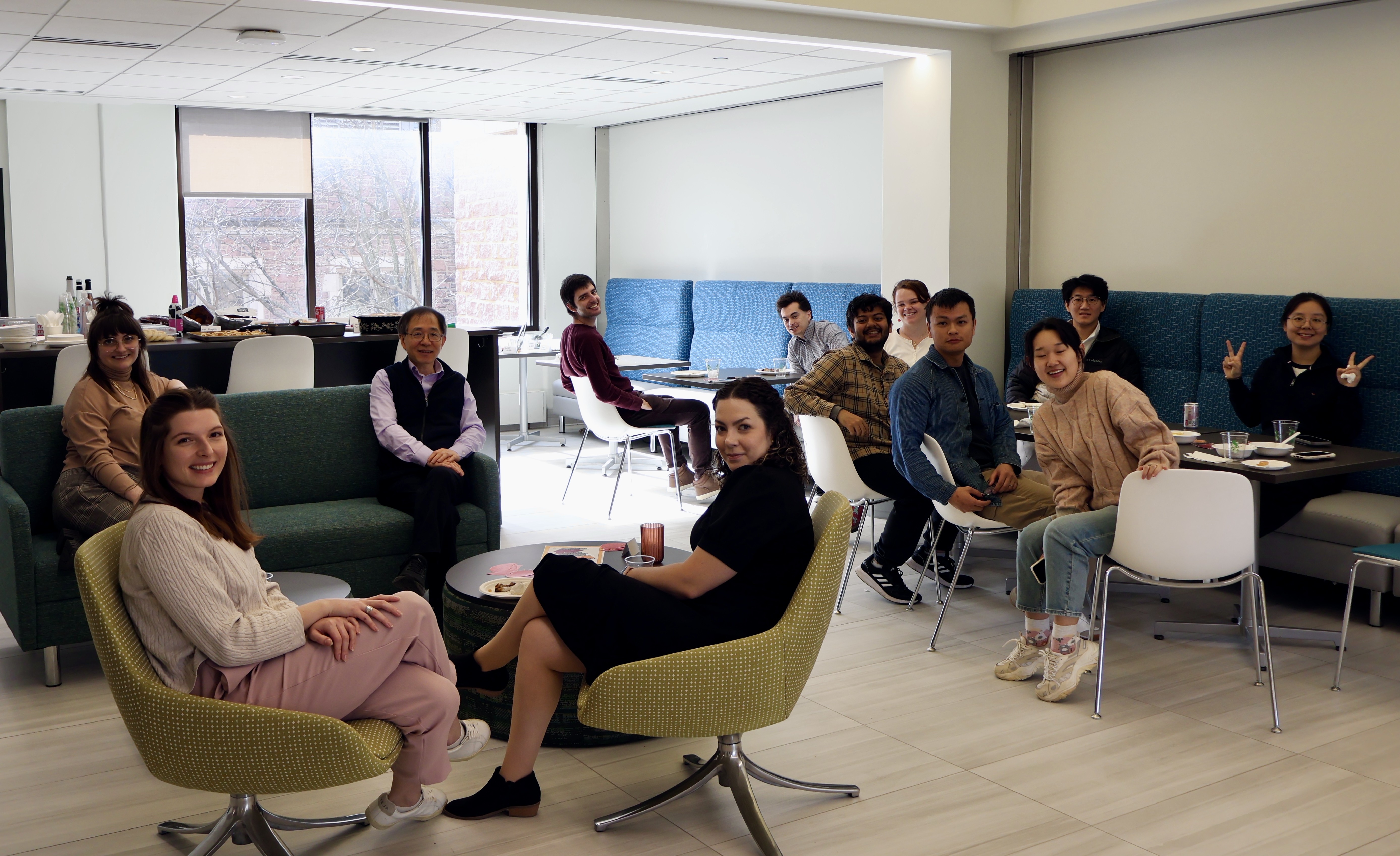 Twelve people from the SDS department smile at the camera