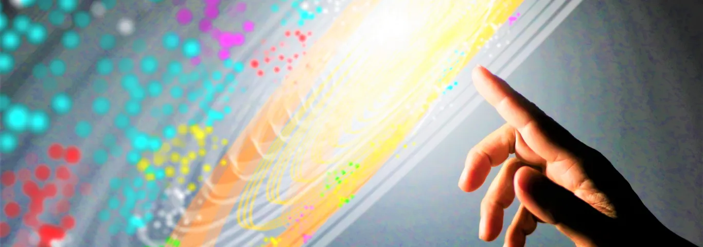 finger touching colorful image of data points 