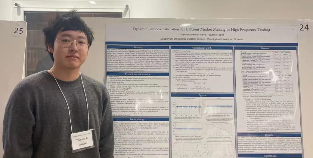 Thomas Li stands in front of a poster board