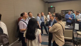 Xuming He mingles at the Alumni and Friends reception