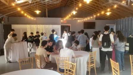 The faculty, graduate students, and staff mingle at the Boat House in St. Louis