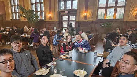 SDS faculty, staff, postdocs, and graduate students mingle in Holmes Lounge at the SDS holiday party 2025