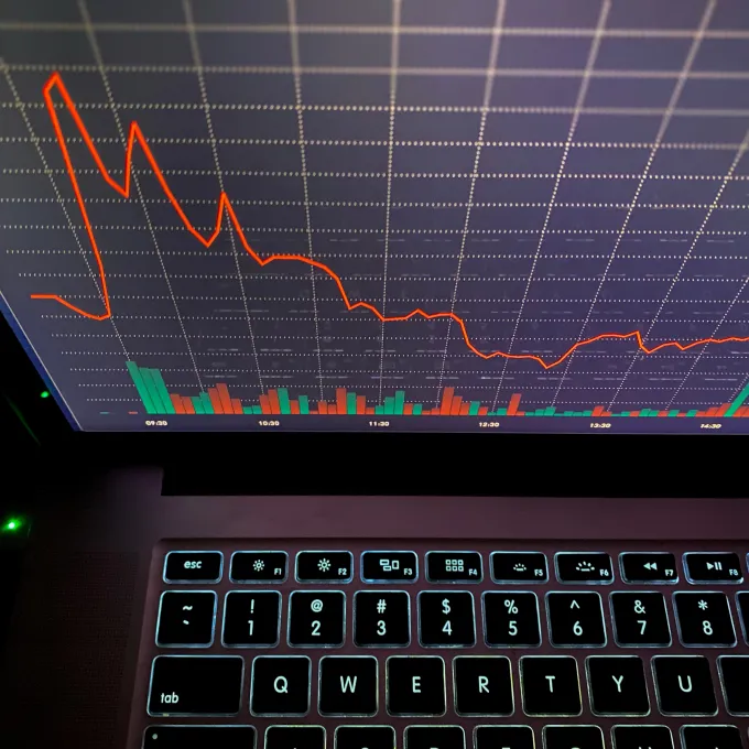 image of laptop with data on screen